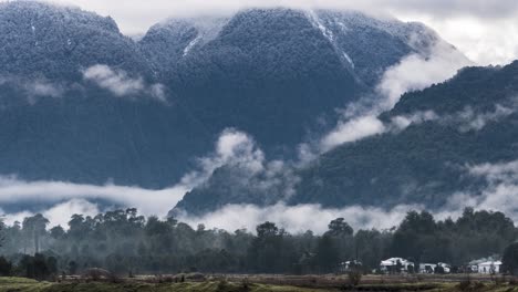 Time-lapse-of-the-foggy-and-snowy-mountains-of-Hornopiren,-Hualaihue,-southern-Chile