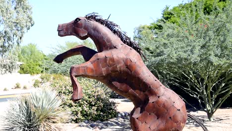 Sculpture-of-a-large-metal-horse-on-hind-legs-profile-view