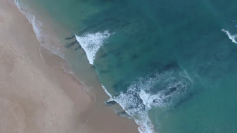 Aerial-of-surfing-along-coast-in-South-Africa