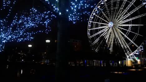 Dark-night-views-of-Echo-arena---lit-Ferris-wheel-in-motion-on-the-dock-waterfront
