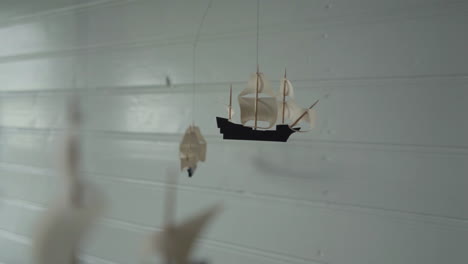 Mobile-of-handmade-ships-hanging-from-ceiling