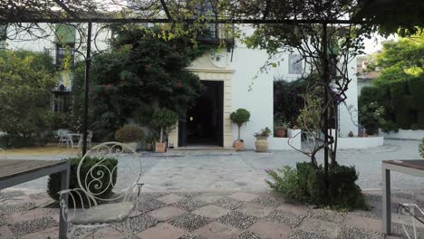 Entering-the-traditional-yard-from-the-garden-of-the-historic,-country-mansion-of-Otivar,-Spain