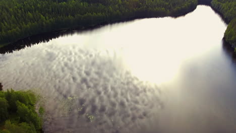 Aerial-fairytale-like-footage-of-a-forest-lake-in-the-borealis-wilderness