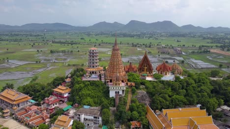 Aerial-Drone-Shot-flying-towards-Wat-Tham-Sua-Temple,-Kanchanaburi,-Thailand