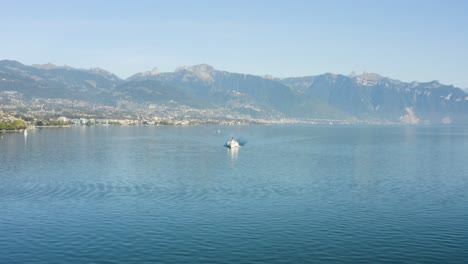 Flying-towards-Belle-Epoque-steam-boat-on-Lake-Léman-with-Vevey,-Montreux-and-the-Alps-in-the-background---Switzerland