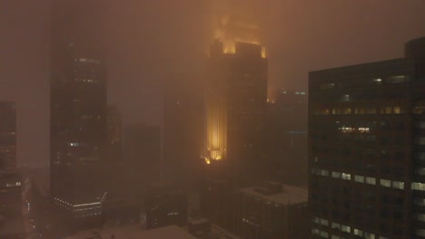 buildings-in-downtown-during-a-snowstorm-at-night