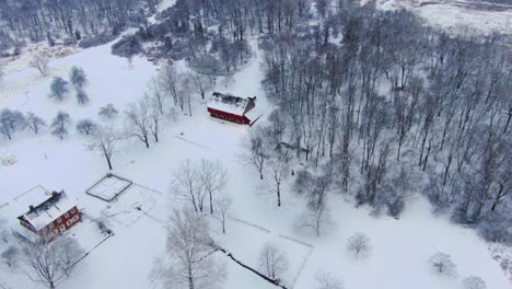 Aerial-flyover-above-historic-mansion-with-a-barn-in-Pennsylvania,-Rock-Ford-Plantation-in-Winter,-home-to-General-Edward-Hand,-adjutant-general-to-George-Washington