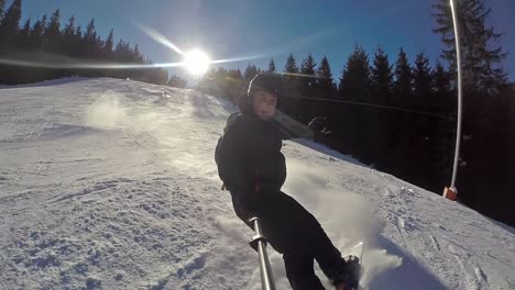 Front-action-cam-view-of-snowboarder-in-slow-motion-nearly-falling-in