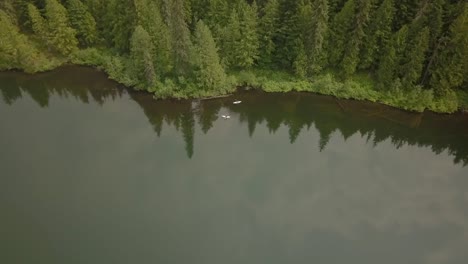 Aerial-view-of-kayakers-on-a-remote-mountain-lake