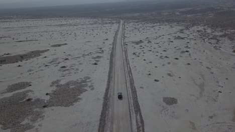 Aerial-Drone-Shot-Following-Vehicle-in-Desert-Death-Valley
