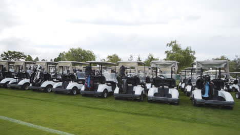Golf-carts-lined-up-on-a-golf-course-on-a-beautiful-sunny-day