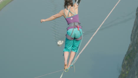 Amazing-cinematic-high-line-slack-line-of-woman-high-above-river