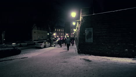 Tourists-walking-on-street-of-old-town-at-night