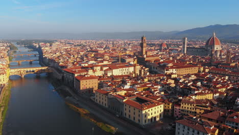 Aerial-view-of-Arno-river-and-the-city-in-the-morning,-Florence,-Italy