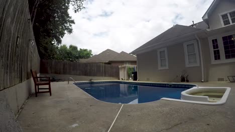 Cloud-timelapse-over-a-backyard-inground-swimming-pool
