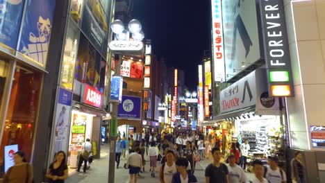 POV-walking,-Famous-shopping-Shibuya-street-with-crowded-on-night