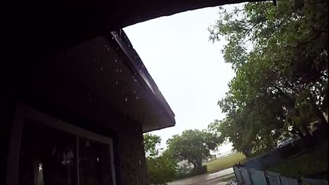 EXTREME-SLOW-MOTION---Rain-drop-off-the-roof-of-a-house-during-a-wet-rain-day