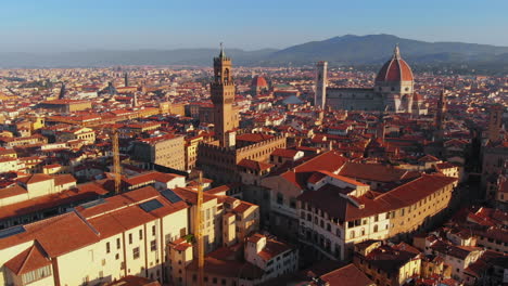 Aerial-cityscape-with-cathedral-and-Duomo-in-background,-morning-light,-Florence,-Italy