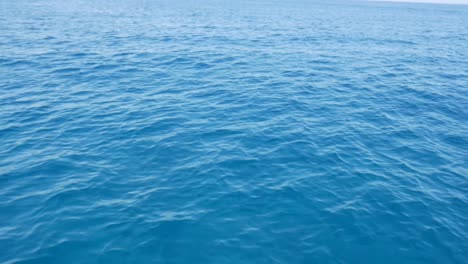 Low-angle-view-of-moving-over-open-waters-of-a-beautiful-blue-sea