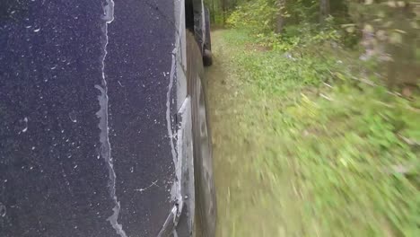 POV-of-pickup-truck-driving-through-a-forest