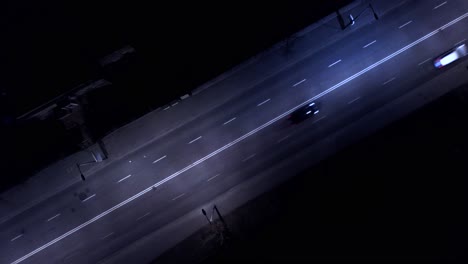 Aerial-shot-of-the-cars,-on-the-road-at-night