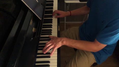 Hands-playing-a-song-on-a-piano
