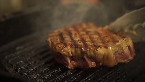 SLOWMO---Close-Up---Flipping-a-Steak-on-BBQ-Grill