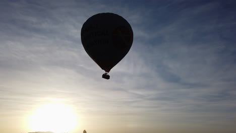 Silhouette-of-a-hot-air-balloon-in-the-sky-in-Goreme,-Cappadocia,-Turkey