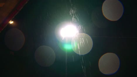 Footage-of-rain-falling-in-the-front-of-a-street-light