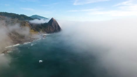 AERIAL:-Descending-through-Oregon's-mist-filled-air-towards-the-mountainous-coastline