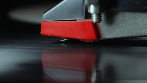 Tonearm-needle-closeup-with-spinning-black-dj-vinyl-3