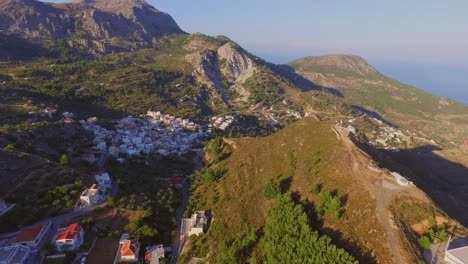 Aerial:-Small-villages-in-the-mountains-of-Karpathos,-Greece
