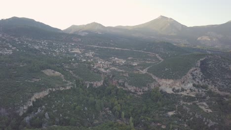 Slow-moving-aerial-clip-taken-by-drone-of-small-village-in-Geyikbayiri-in-Turkey-amidst-the-rocky-mountainous-landscape