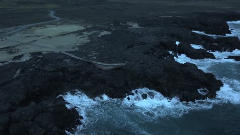 Cold-Waves-Crashing-Into-Natural-Rock-Pool-on-Sea-Cliffs-of-Iceland