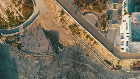 Aerial-shot-of-people-walking-on-the-beach-of-Tijuana