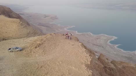 Group-of-people-enjoying-the-scenic-view-of-the-Dead-Sea