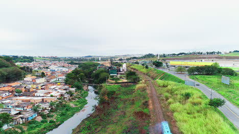 Aerial-video-of-a-moving-train-in-the-city-of-Campinas,-Brazil