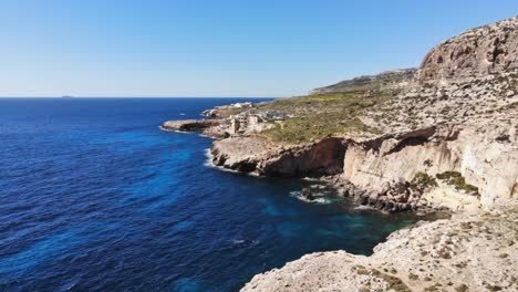 Aerial-drone-hyperlapse-video-from-Malta,-Siggiewi,-Ghar-Lapsi-area-on-a-sunny-spring-day