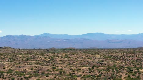 Aerial-long-flight-over-the-beautiful-open-Sonoran-desert-toward-the-Four-Peaks-in-the-Matazel-Mountains,-Scottsdale,-Arizona-Concept:-travel,-tourism