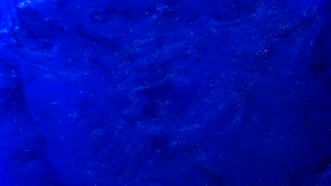 Abstract-blue-paint-splatter-background-with-smokey-ink-in-liquid-water-SLOW-MOTION