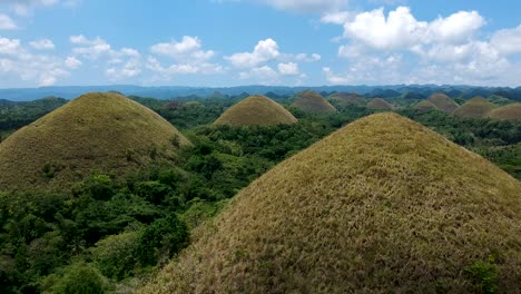 Low-flying-aerial-of-Chocolate-Hills,-Bohol,-Philippines