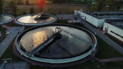 Aerial-view-of-sewage-treatment-plant,-camera-moving-right