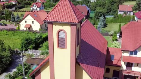 Aerial-shot-of-a-small-church-with-a-a-cross-on-top