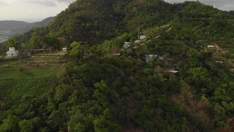 Aerial-overhead-drone-view-of-a-fort-with-restored-canons-and-a-village-located-in-the-background