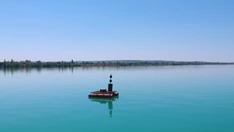 Red-Bouy-at-the-lake-Balaton,-Hungary-Siofok-Recorded-with-a-Dji-drone-1080p