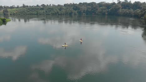 Aerial-shot-flying-over-people-on-stand-up-paddle-boards-on-the-river-Nile-in-Africa