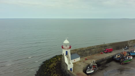 Aerial-4k-pan-flyover-shot-of-lighthouse,-balbriggan-lighthouse