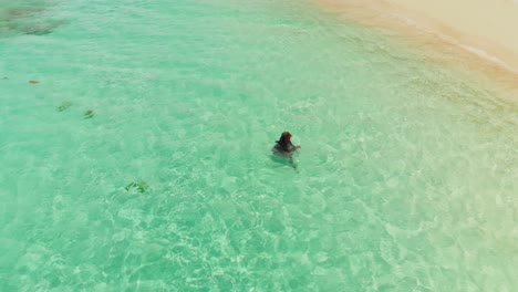 Drone-footage-of-a-model-enjoying-the-amazing-beach-on-Petit-St-Vincent