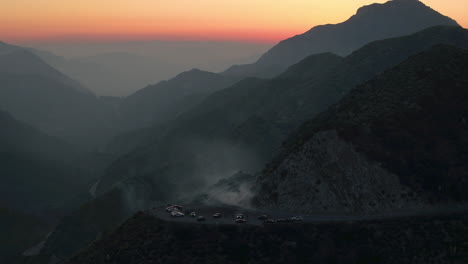 Done-shot-of-muscle-and-sports-cars-doing-doughnuts-and-burnouts-with-a-car-club-in-the-Angeles-National-Forest-in-Southern-California-during-Sunset
