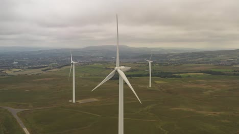 Drone-footage-of-a-group-of-wind-turbines-on-farmland